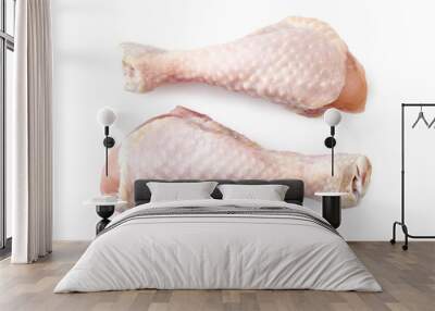 Two raw chicken legs isolated on white background. Top view. Wall mural