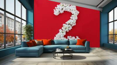 The number 2 is written in white lilac flowers on a red background. The number two is written in fresh flowers, isolated on red. Arabic numeral lined with flowers. Wall mural