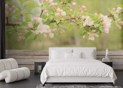 Empty wooden table with blurred spring background of blossoming wild apple tree. Mock up for display or montage products Wall mural