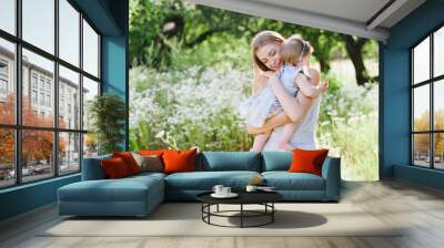 Young mother playing with her little daughter on the nature, motherhood, tenderness, childhood, tenderness, lifestyle Wall mural