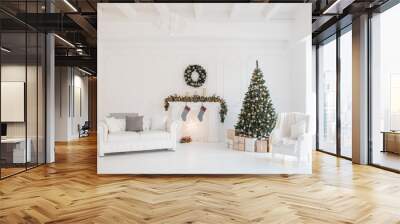 Christmas and New Year decorated white interior room with presents and New year tree and fireplace Wall mural