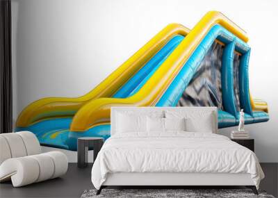 A vibrant inflatable water slide stands tall on a white background, ready for summer fun Wall mural