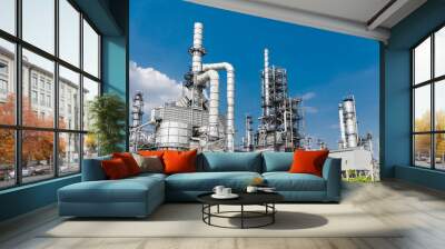 Oil and gas industrial,Oil refinery plant form industry,Refinery factory oil storage tank and pipeline steel blue sky background Wall mural