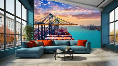 Aerial view of cargo ship and cargo container in harbor. Wall mural