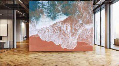 Aerial view of pink beach and blue ocean wave. Wall mural