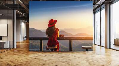 Alone girl sitting on a chair. Wall mural