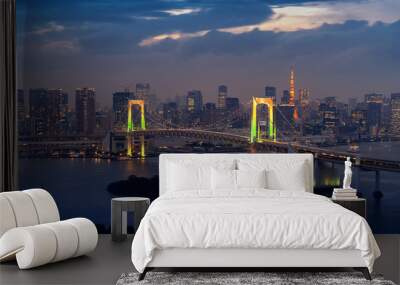 View of Tokyo cityscape and Rainbow bridge at night in Japan. Wall mural