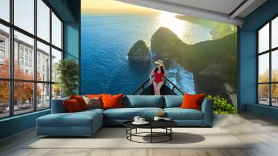 Woman enjoying at Kelingking Beach in Nusa penida island, Bali, Indonesia. Wall mural