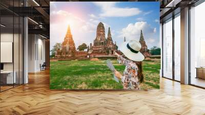 Young girl at Ayutthaya Historical Park, Wat Chaiwatthanaram Buddhist temple in Thailand. Wall mural