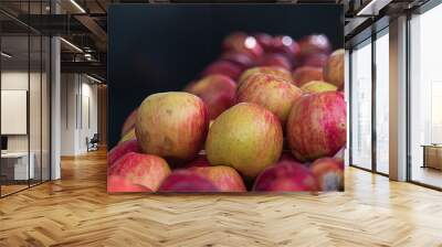 stacked apples fresh and ready to sell at market Wall mural