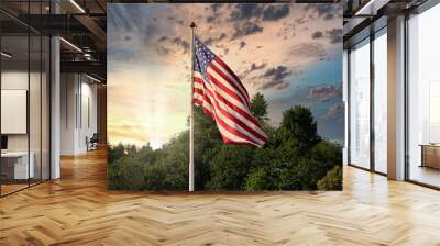 sunset and weather with cloudy sky behind american flag blowing in the wind Wall mural