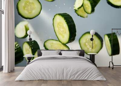 Freshly sliced cucumber and zucchini on a white background, showcasing green, healthy vegetables cut into slices, ideal for salads and healthy eating Wall mural