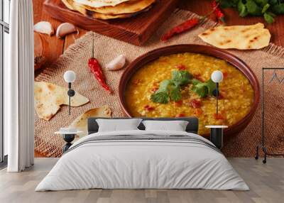 .Thick indian red lentil soup with cilantro served with indian f Wall mural