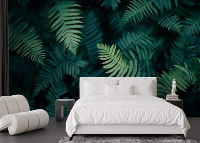 A close-up of lush green fern fronds, creating a natural background. Wall mural