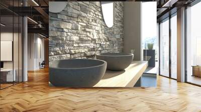 Two grey sinks sit atop a wooden countertop in a bathroom with a stone wall and a view of mountains outside. Wall mural