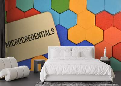 Colorful wooden blocks and label tag written with MICROCREDENTIALS. Wall mural