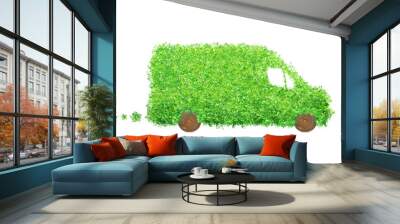 IIsolated delivery van made of leaves and wood. Electric cargo car, transportation and environmental concept Wall mural