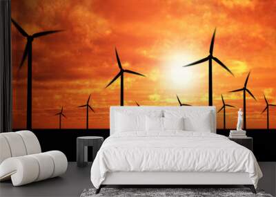 wind generators over orange sky Wall mural