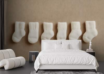 Neatly Arranged White Baby Socks Wall mural