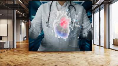 Close up of professional doctor holding heart anatomy hologram floating at hospital. Smart medical worker checking and preparing for heart surgery by using technology innovation. Cardiology. Remedial. Wall mural