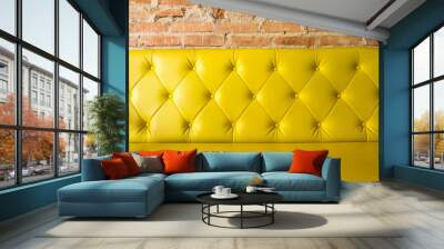 Yellow leather sofa and brick wall background. Wall mural