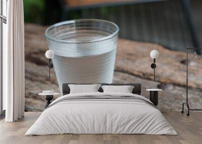 glass of water on a table Wall mural