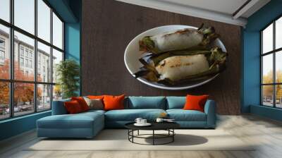 Grilled sticky rice filled with banana and taro Wall mural