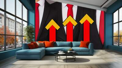 abstract business man stands on the peak of success amid tall, innovative Arrows point the way to success. and graphs with statistics to analyze business potential and predict future developments in Wall mural