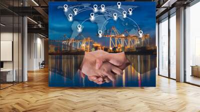 double exposure of business people handshake greeting deal concept on industrial port with container Wall mural