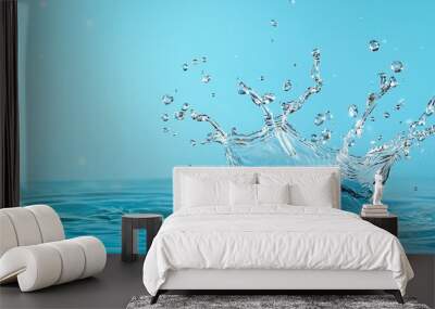 A captivating splash of water against a serene blue background, highlighting movement and freshness in an aquatic environment. Pouring Fresh Drinking Water. Wall mural