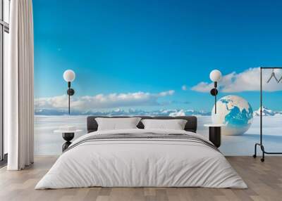 A serene landscape featuring an orb depicting Earth, surrounded by a vast snowy expanse and clear blue sky, symbolizing global awareness. Wall mural