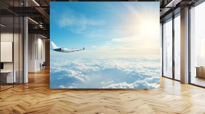 A serene view of a plane soaring above clouds under a bright sky, symbolizing freedom and adventure in travel. Luxurious Airline First-Class Cabin . Wall mural