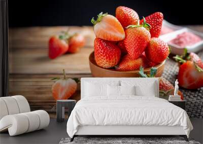 Fresh strawberries in wooden bowl. Wall mural