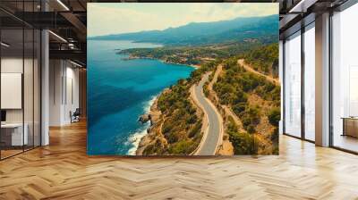 Scenic coastal landscape with winding road and clear blue waters, aerial view. Wall mural