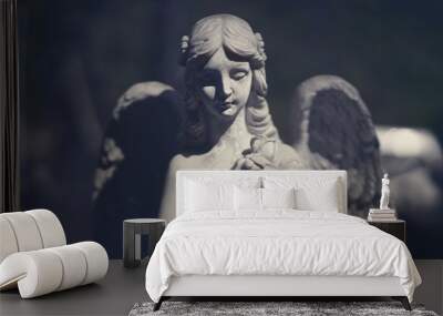 beautiful angel statue in darkness. Wall mural