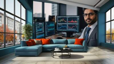 South Asian Financial Securities Trader Working on Desktop Computer in a Modern Office, Handsome Indian Accountant Bookkeeping Financial Affairs of a Business Venture Wall mural