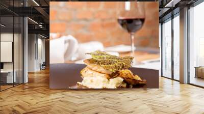 Sturgeon, savoy cabbage, mushrooms broth, mashed potato with butter served in a restaurant Wall mural