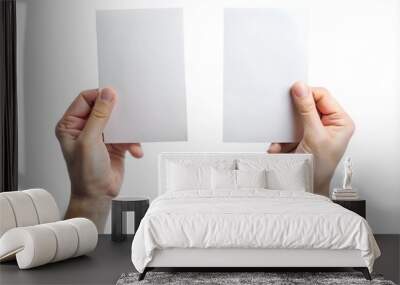 Hand giving two blank sheets of paper (tickets, flyers, invitations, coupons, money, etc.), isolated on white background Wall mural