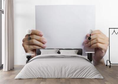 Hands holding a sheet of white paper, isolated on white background Wall mural