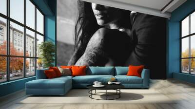 Beautiful, young couple posing on camera indoors Wall mural