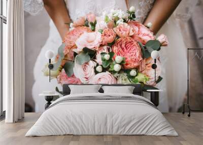 Bride with bouquet, closeup Wall mural