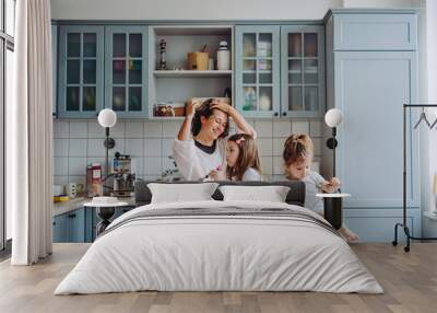 Happy family having fun in the kitchen Wall mural