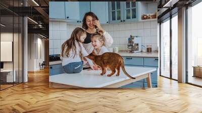 Happy family having fun in the kitchen Wall mural