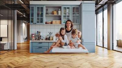 Happy family having fun in the kitchen Wall mural