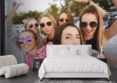 Six young beautiful girls looking at the camera and taking a selfie Wall mural