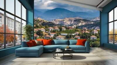 View of Bulgarian ski resort Bansko at summer time, peaks of Pirin mountains in the background. Wall mural