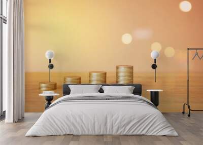 stacks of money coin on wooden desk with brown background  Wall mural