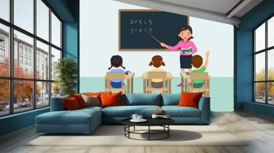 Young female teacher teaching math lesson to students in the classroom  Wall mural