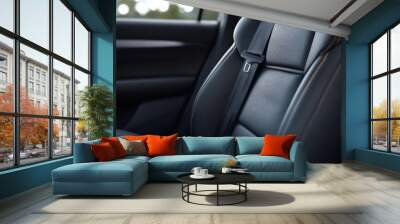 Close-up view of a modern car interior seat with black leather and seatbelt, showcasing luxury and comfort in vehicle design. Wall mural