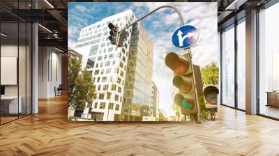 A city crossing with a semaphore. Green light in semaphore - image Wall mural